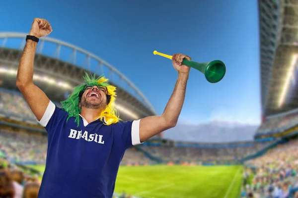 Brazilian fan celebrating at stadium — Stock Photo, Image