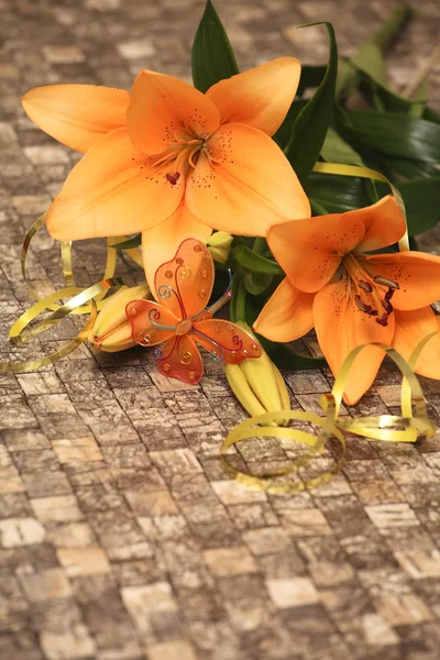 Orange lily with decorations — Stock Photo, Image