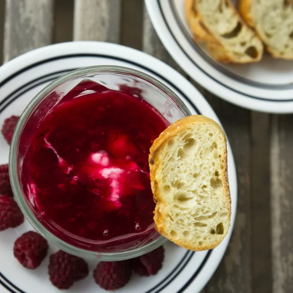 Dessert organic yogurt with raspberry jelly and french baguette — Stock Photo, Image