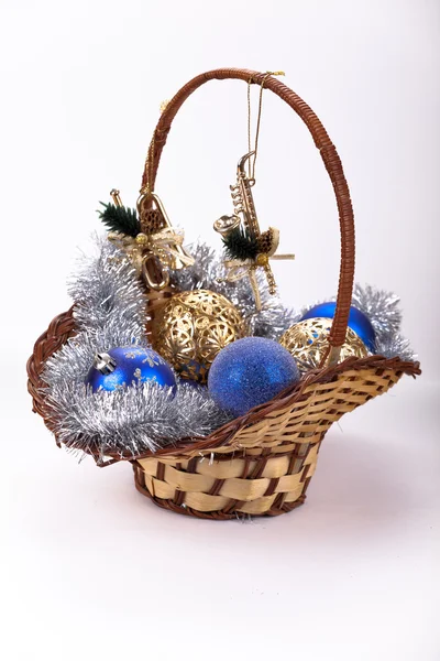 Basket full of blue silver and gold new year and christmas decorations — Stock Photo, Image