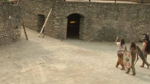 Roman and gallic soldier during a reenactment of war between Romans and Cottians — Stock Video