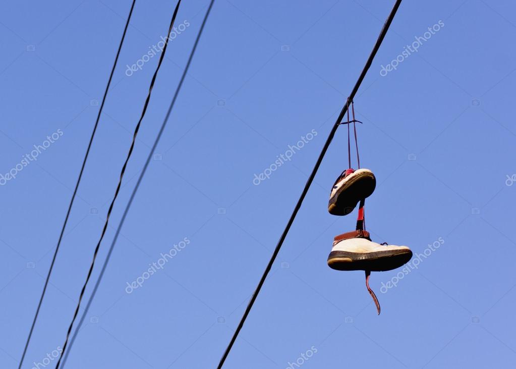 Shoes hanging from power line — Stock Photo © guynamedjames #22336337