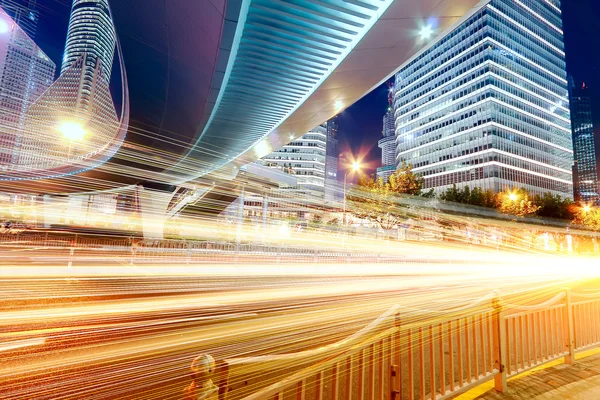 The light trails on the modern building background in shanghai china — Stock Photo, Image