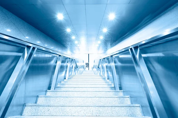 Blue moving escalator in the office hall perspective view — Stock Photo, Image