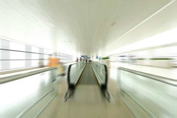 Blue moving escalator in the office hall perspective view — Stock Photo, Image