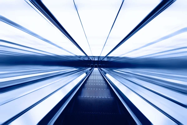 Blue moving escalator in the office hall perspective view — Stock Photo, Image