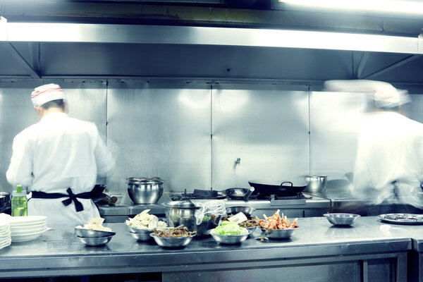 Motion chefs of a restaurant kitchen