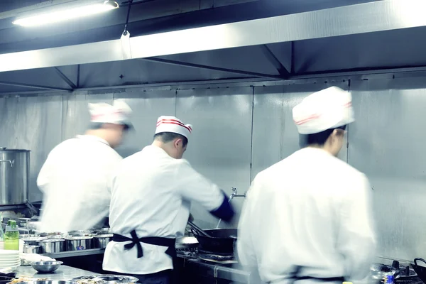 Motion chefs of a restaurant kitchen — Stock Photo, Image