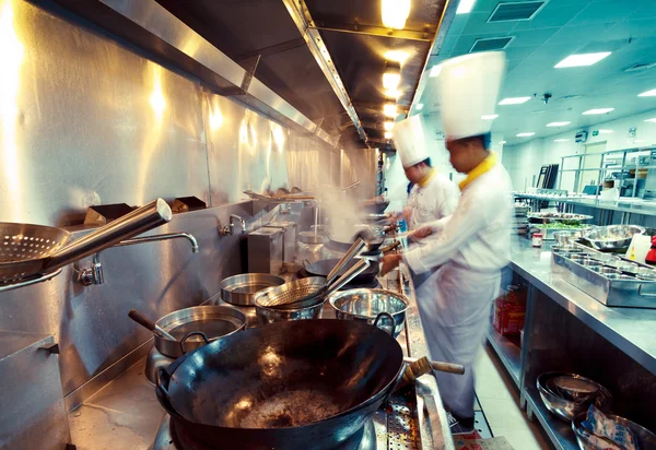 Motion chefs of a restaurant kitchen — Stock Photo, Image