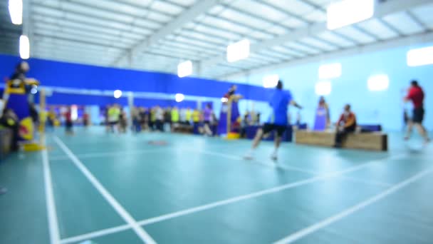 Badminton courts with players competing in indoor. — Stock Video
