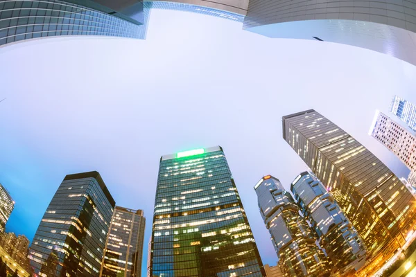 The light trails on the modern building background in hongkong c — 图库照片