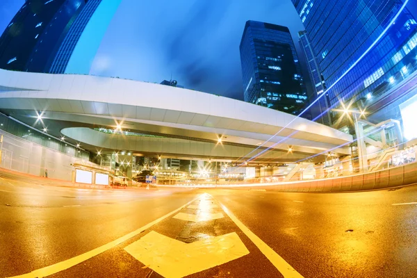 The light trails on the modern building background in shanghai china — Stock Photo, Image