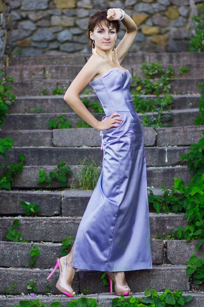 Slim beautiful brunette woman in evening dress — Stock Photo, Image