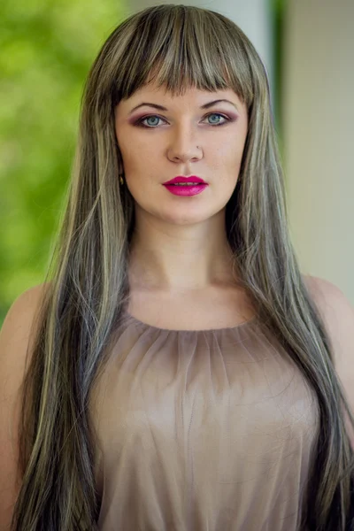 Portrait of a beautiful girl on nature with very long hair — Stock Photo, Image