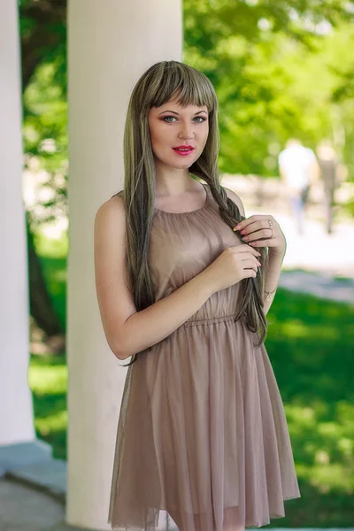 Portrait of a beautiful girl on nature with very long hair — Stock Photo, Image