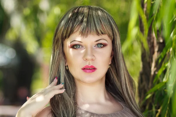 Portrait of a beautiful girl on nature with very long hair — Stock Photo, Image