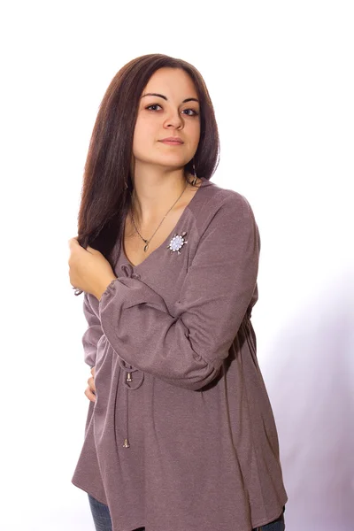 Studio portrait of a beautiful young brunette woman in autumn style clothes — Stock Photo, Image