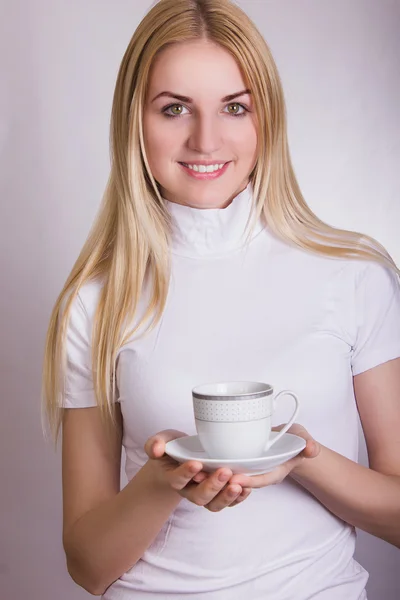 Portrait of a beautiful young blonde woman in the studio on a white background. — Stock Photo, Image