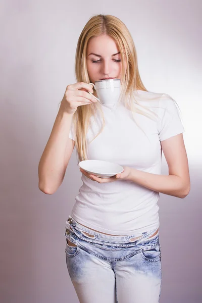 Portrait of a beautiful young blonde woman in the studio on a white background. — Stock Photo, Image