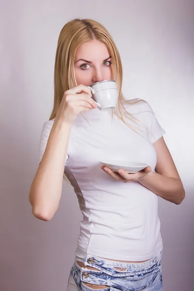 Portrait of a beautiful young blonde woman in the studio on a white background. — Stock Photo, Image