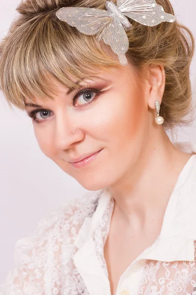 Portrait of a beautiful young blonde woman in sexy lace blouse. — Stock Photo, Image