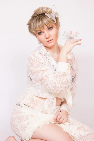 Portrait of a beautiful young blonde woman in sexy lace blouse. — Stock Photo, Image