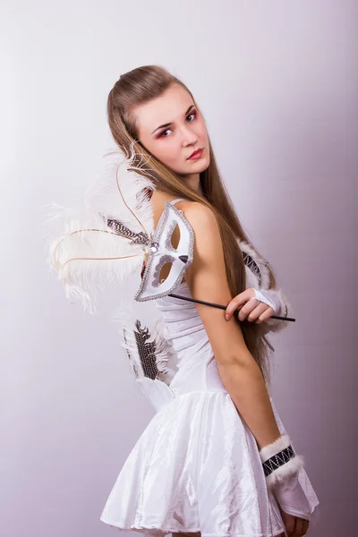 Portrait of a beautiful young woman with long hair in a studio. Girl dressed in carnival costume on Halloween birds — Stock Photo, Image
