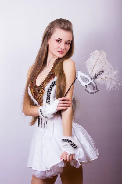 Portrait of a beautiful young woman with long hair in a studio. Girl dressed in carnival costume on Halloween birds — Stock Photo, Image