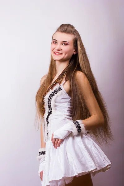 Portrait of a beautiful young woman with long hair in a studio Girl dressed in carnival costume on Halloween birds — Stock Photo, Image