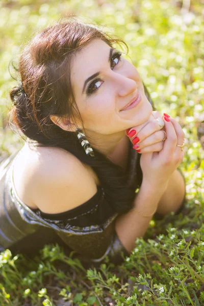 Luxury woman in a long black evening dress in the park — Stock Photo, Image