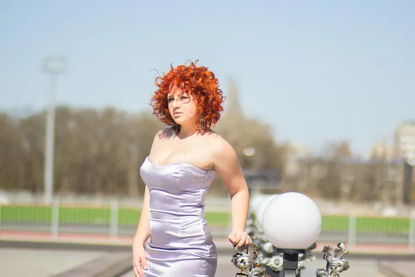 Gorgeous red-haired woman on a walk in the park. Young girl on the nature — Stock Photo, Image