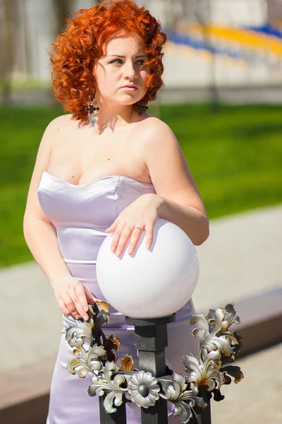 Gorgeous red-haired woman on a walk in the park. Young girl on the nature — Stock Photo, Image