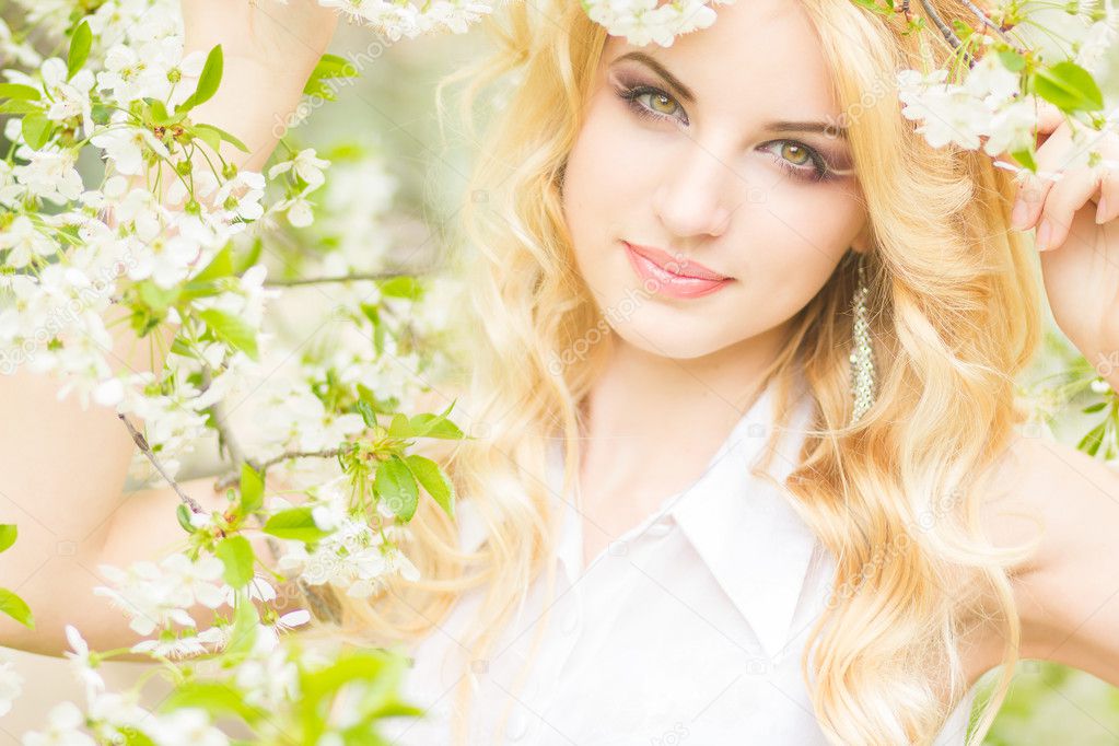 Spring portrait of a beautiful young blonde woman.