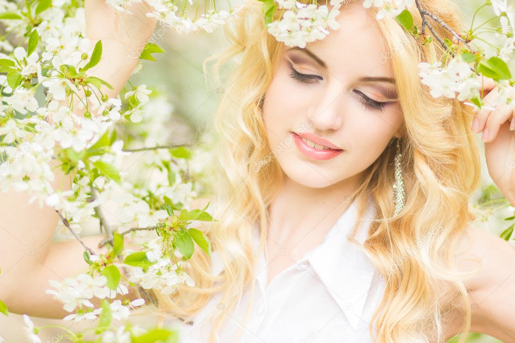 Spring portrait of a beautiful young blonde woman.