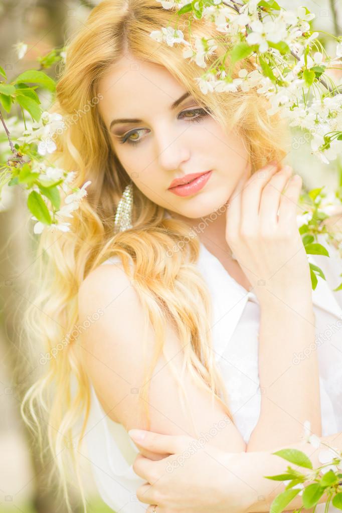 Spring portrait of a beautiful young blonde woman.