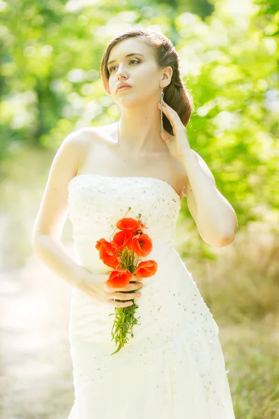 Beautiful bride outdoors - soft focus — Stock Photo, Image