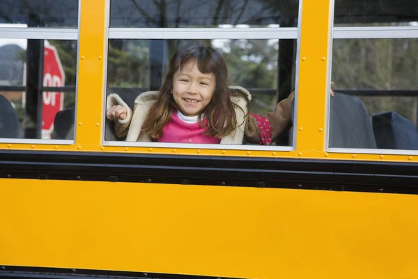 Young Asian girl on school bus