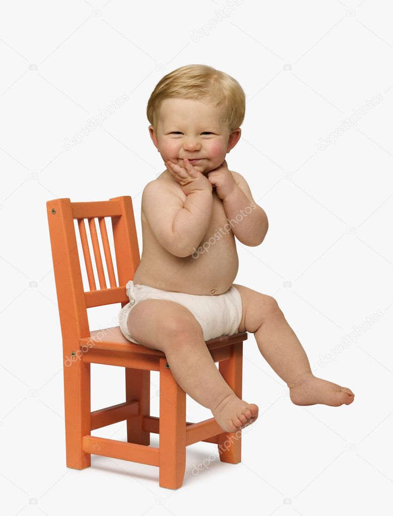 baby sitting in chair