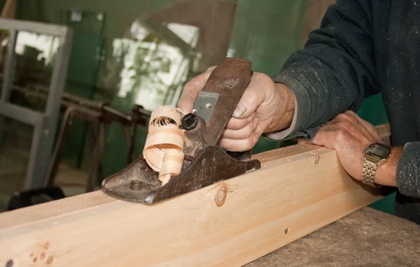 Professional carpenter working manual plane — Stock Photo, Image