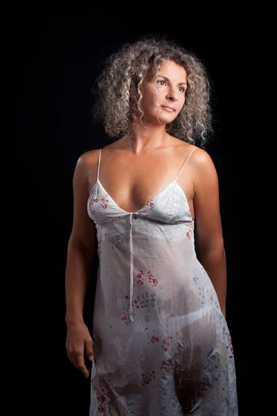 Curly mature woman wearing lingerie posing black background — Stock Photo, Image