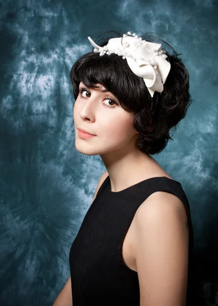 Woman wearing black dress and felt adornment — Stock Photo, Image