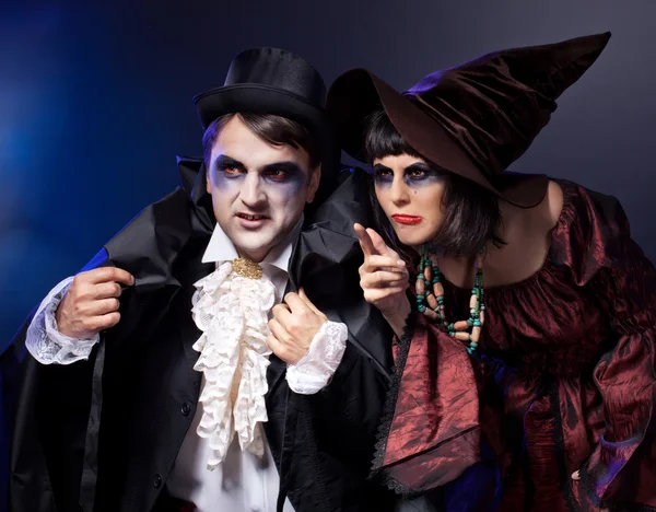 Man and woman wearing as vampire and witch. Halloween — Stock Photo, Image