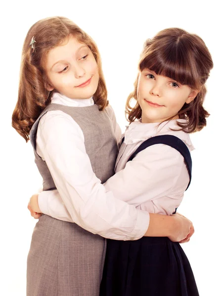 Due bambine che parlano. Isolato su bianco — Foto Stock