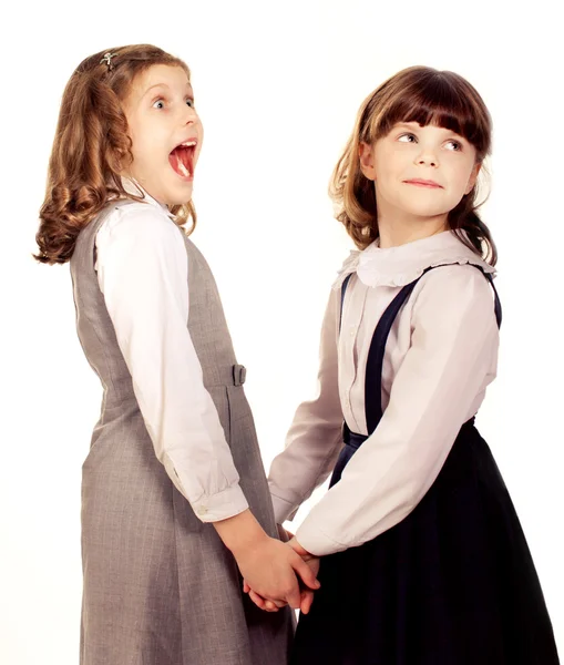 Two little girls talking. Isolated on white — Stock Photo, Image