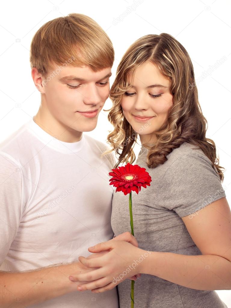 Teenager preset his girlfriend flower. Valentine day.