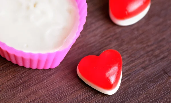 Jelly and preparing dough in heart s shape on the table — Stock Photo, Image