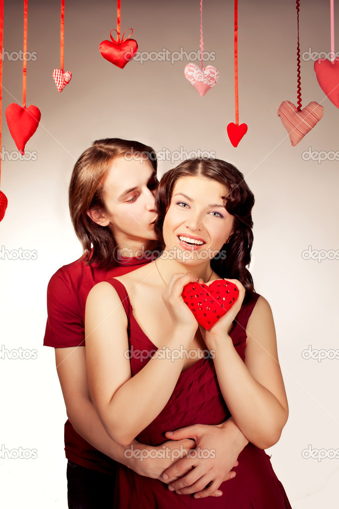 Couple of lovers. Woman holding handmade heart.