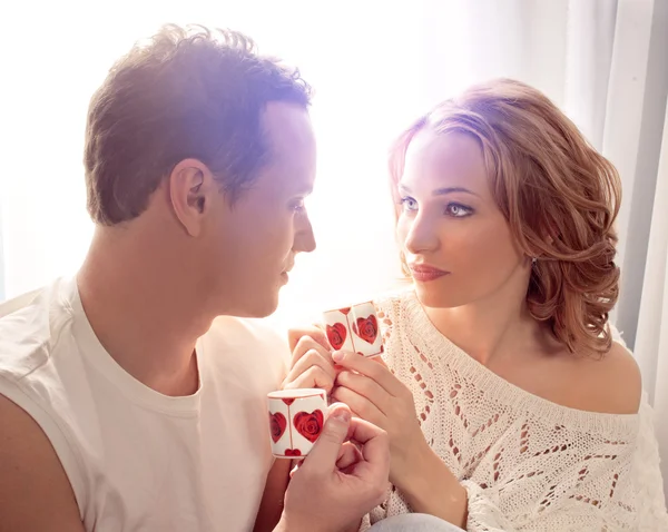 Mature couple of lovers. Man presents flower — Stock Photo, Image