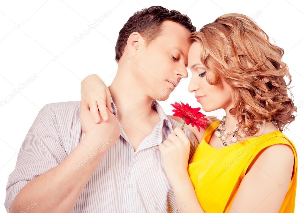 attractive couple of lovers. Man presents flower. Valentine s d