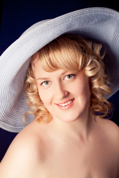 Portrait of a beautiful female model on dark background — Stock Photo, Image